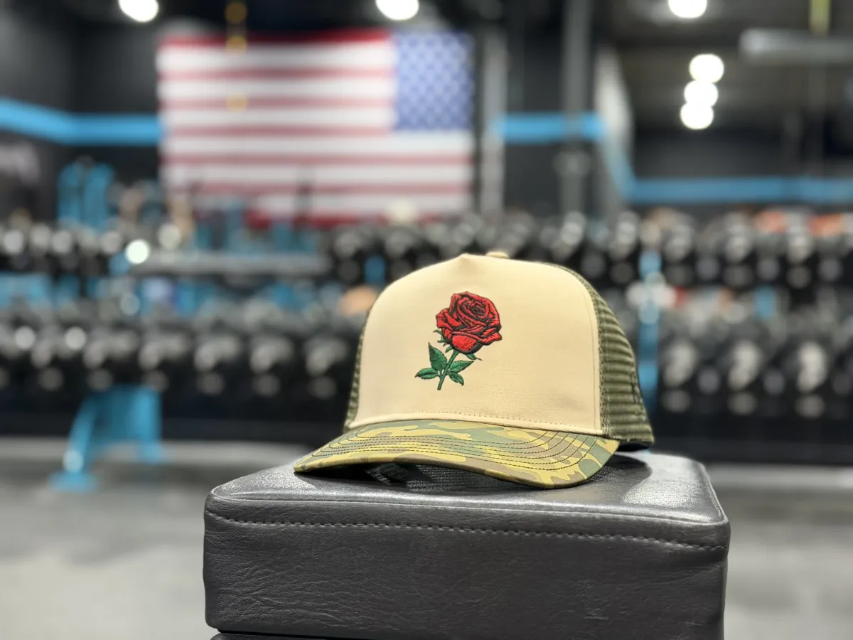 Rose camo trucker hat in the gym
